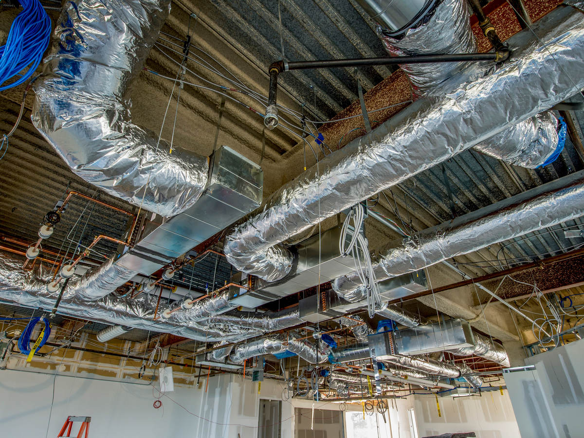 Freshly installed and cleaned ductwork running across a building ceiling